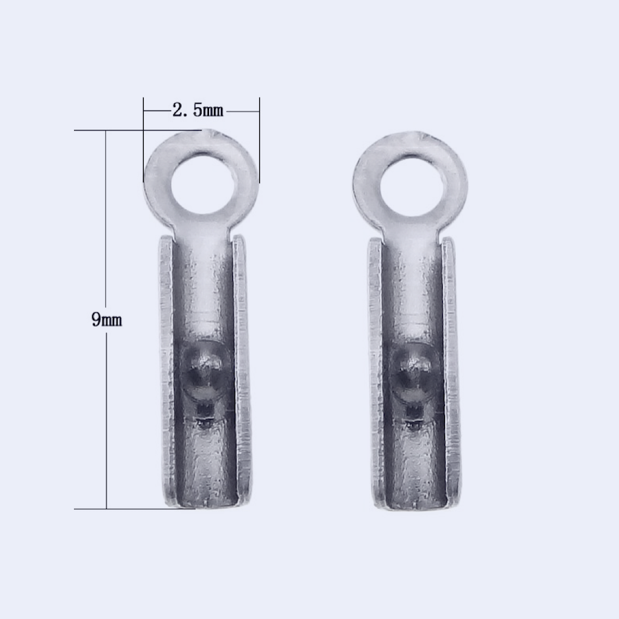 Ohut nyörinpää sivulta: kapea sylinteri ja kiinnityssilmukka, 9 x 2 mm kirurginteräs