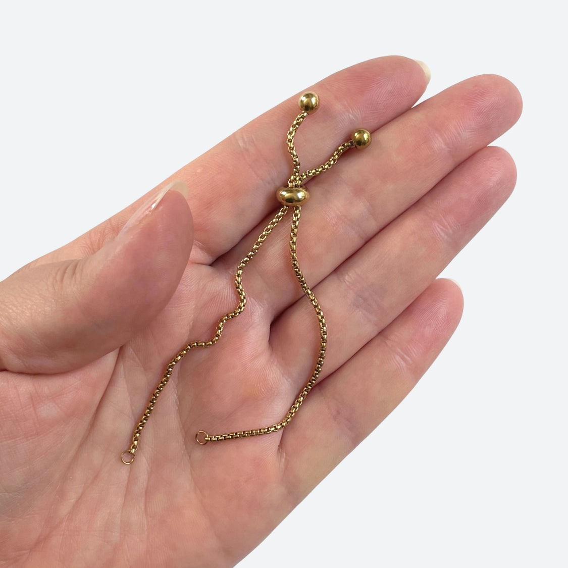 Rannekorupohja liukulukolla 22 cm, 18K PVD-kullattu kirurginteräs